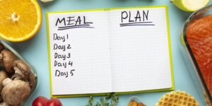 top-view-arrangement-with-meal-planning-notebook